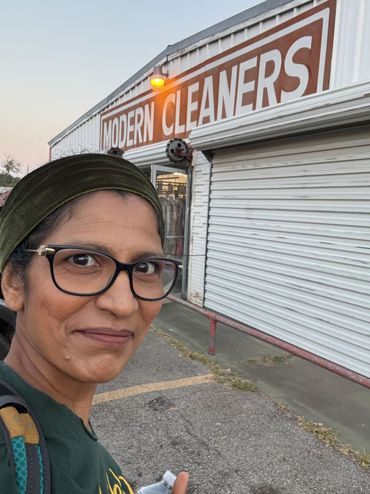 Punita outside Modern Cleaners in Texas, thirty-three years after her first job there